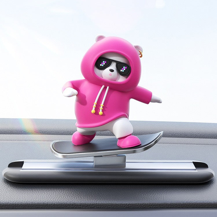 Moving bear car decor installed on vehicle display screen