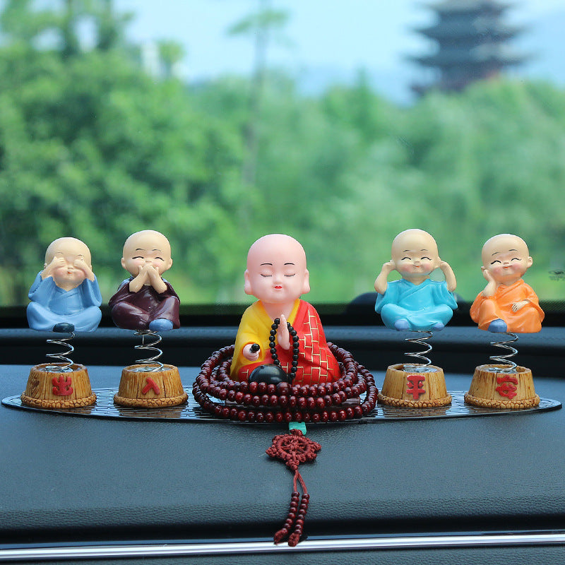 Buddhist inspired monk figurine for car dashboard decoration
