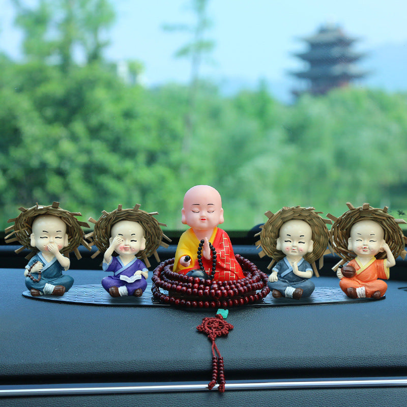 Solar monk car decoration installed on vehicle dashboard